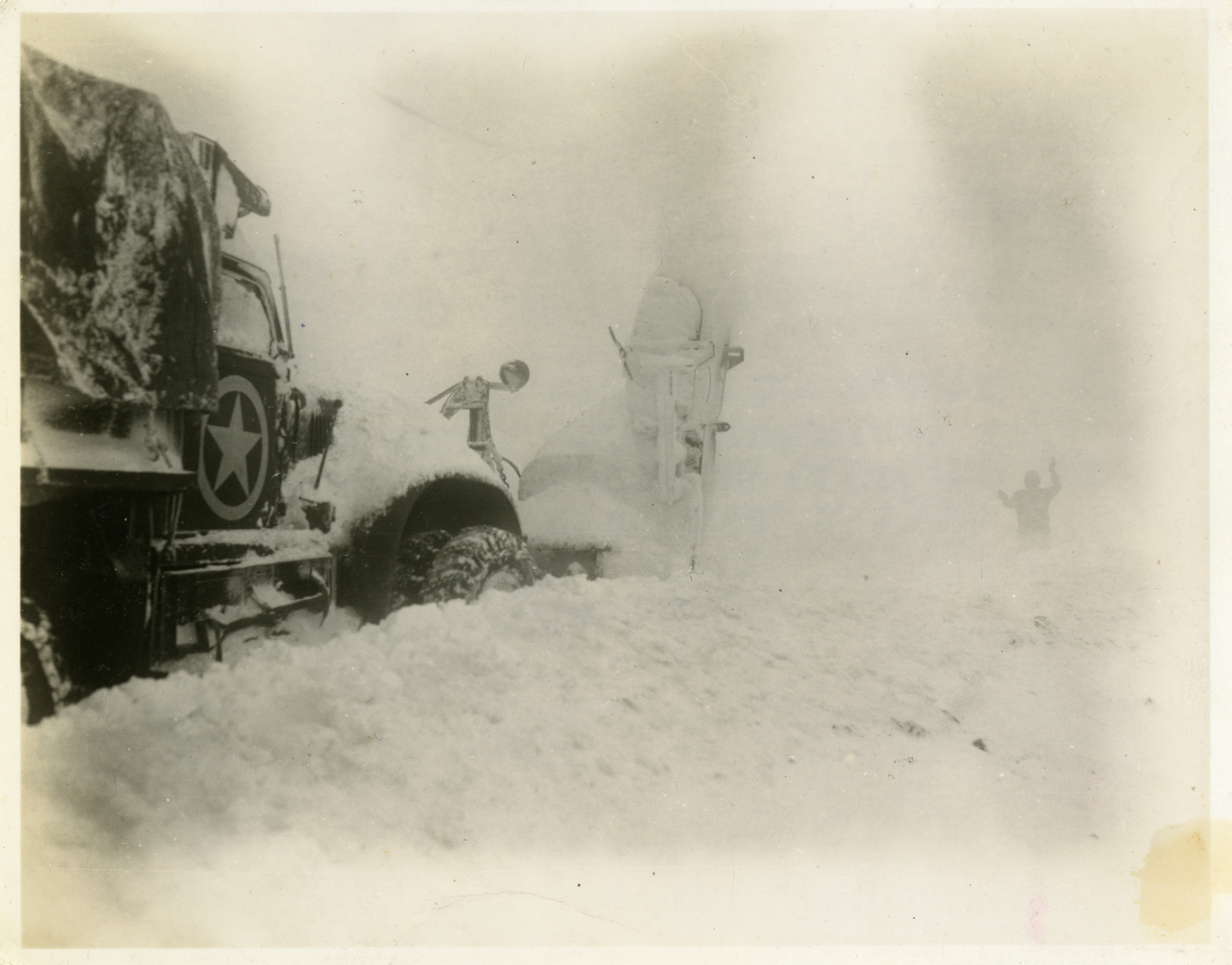 An Engineer group snow plough clears snow from an important supply route in  Italy on 7 January 1945.