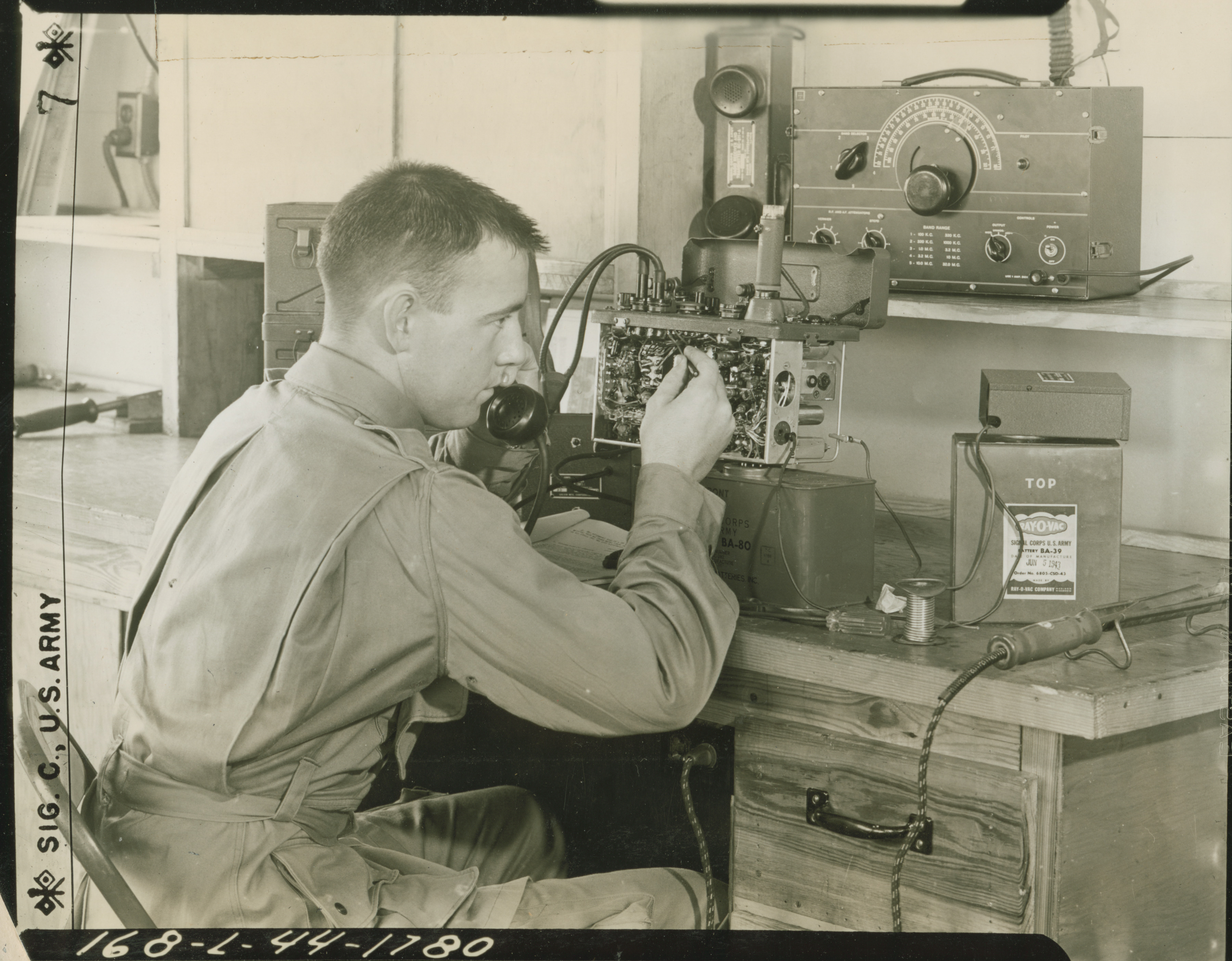 Private repairs a radio at Fort Benning, Georgia on 11 July 1944