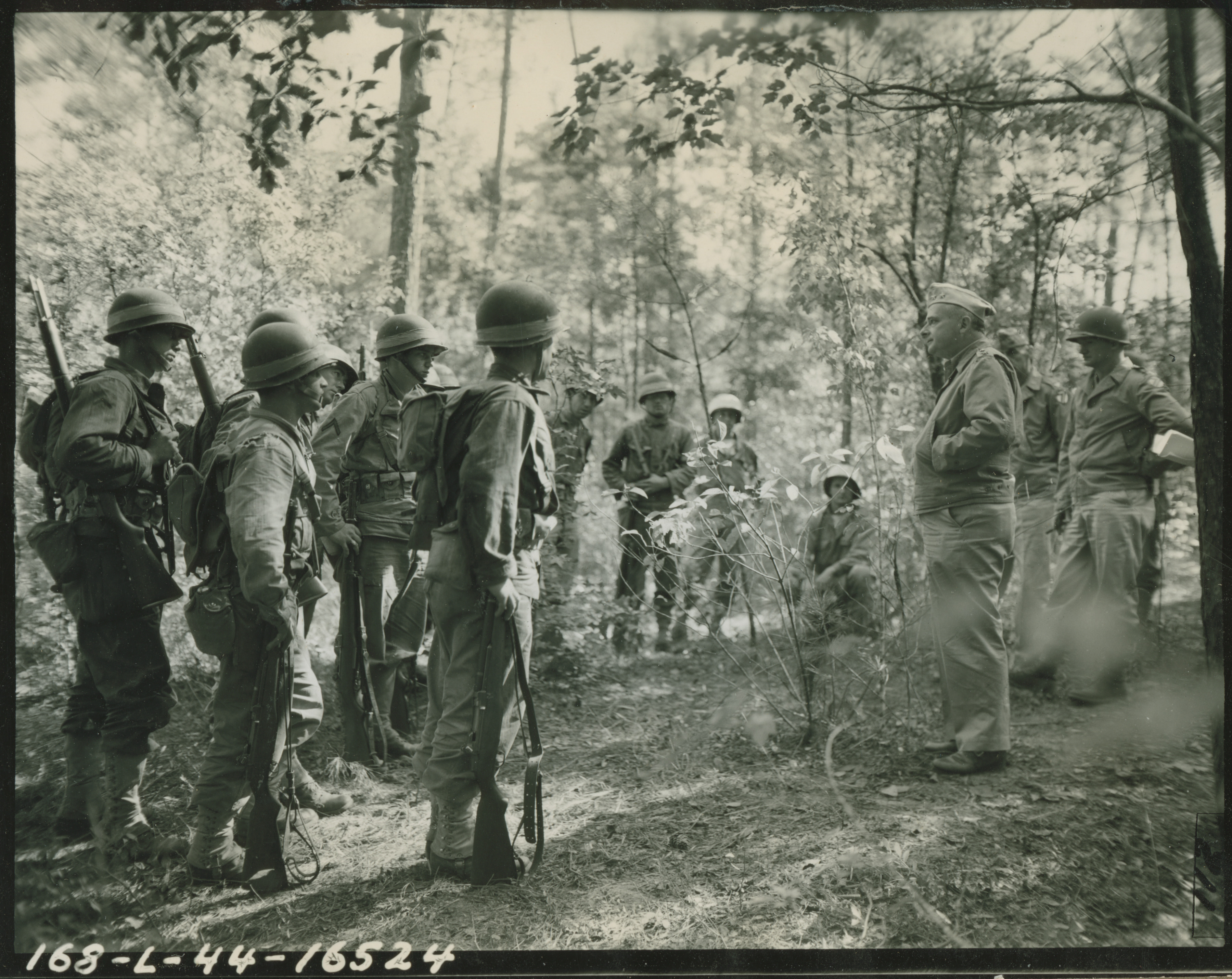 71st Division Commander Major General Landrum in the field talking to ...
