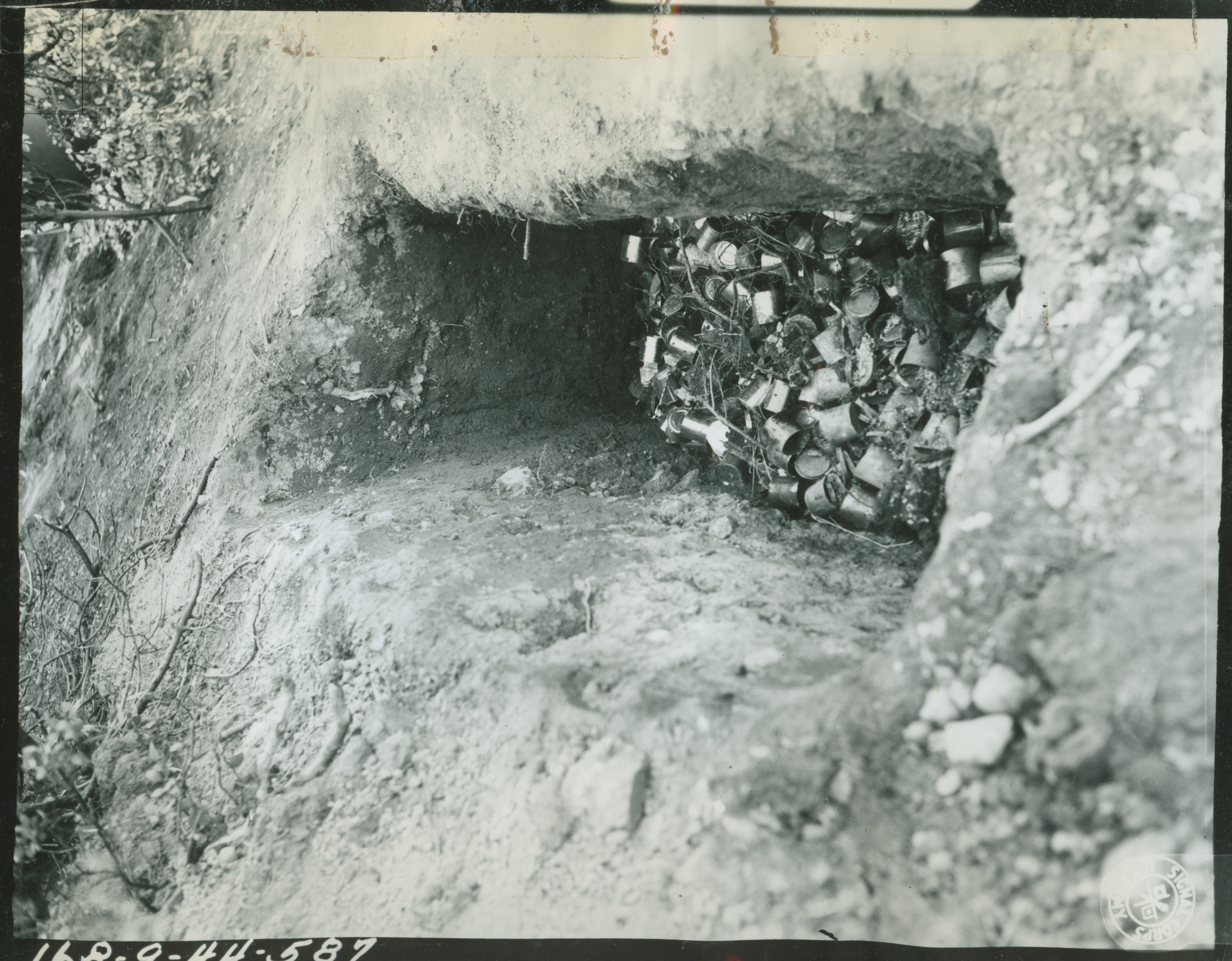Oral HistoryImage Controlled VocabularyIMAGE TAGSA disposal pit for C Ration cans near bivouac areas at Hunter Liggett Military Reservation on 22 March 1944Your browser is out of date!
