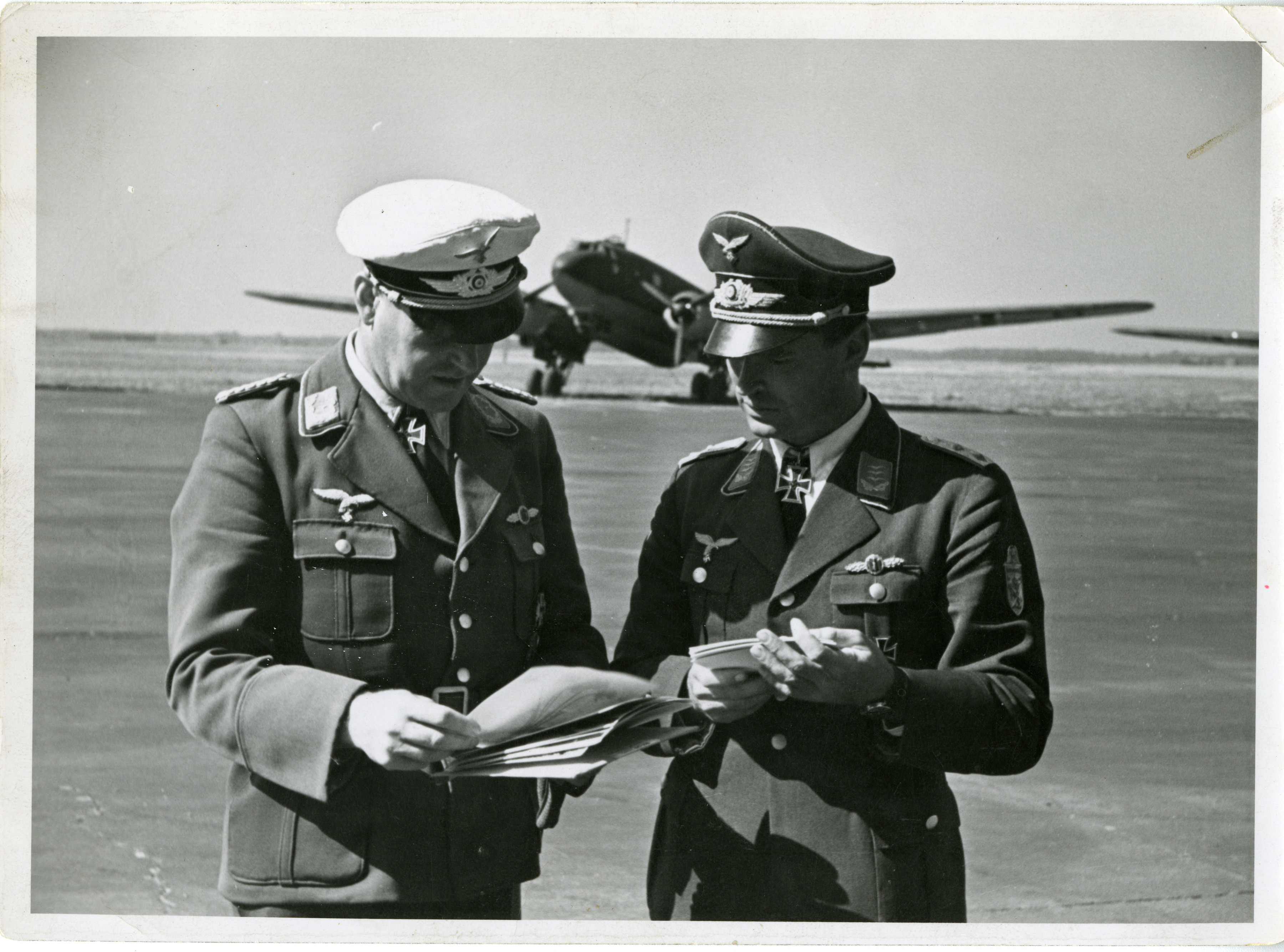 Two Luftwaffe officers looking over documents, ETO, October 1941 | The ...