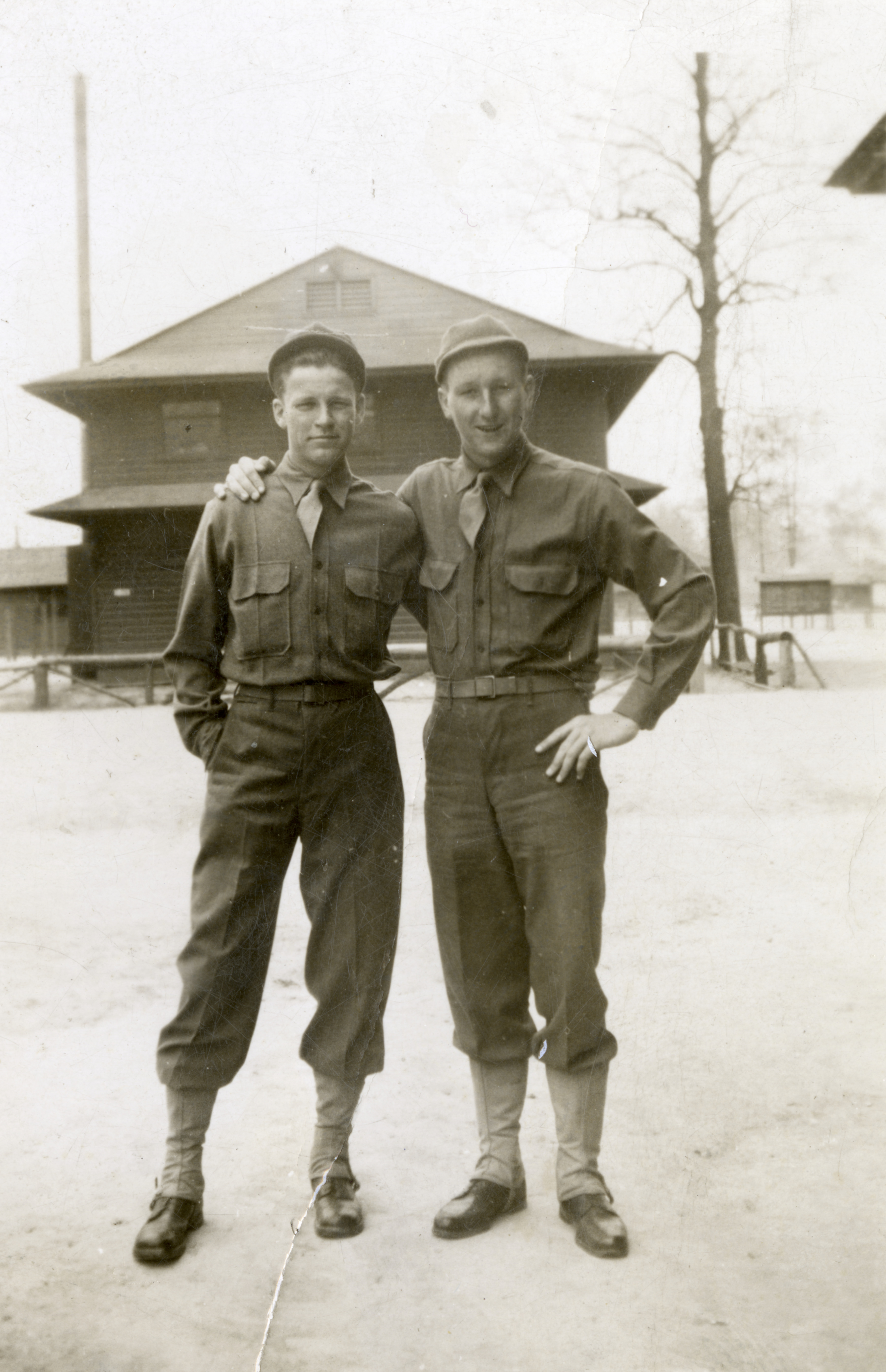 Two Army Air Force servicemen pose on campgrounds in the United States