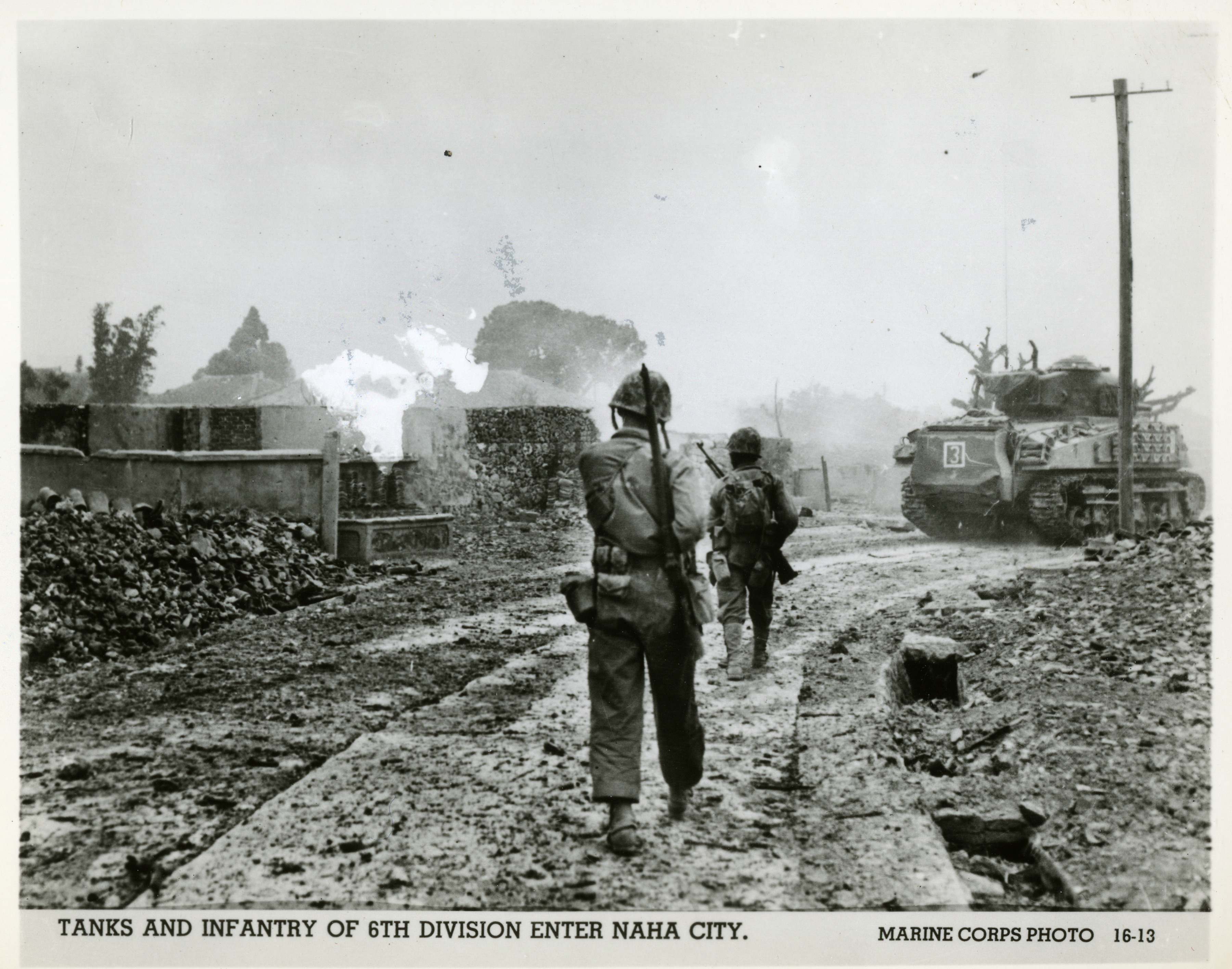 6th Marine Division Advancing Through War damaged Naha Okinawa 1945 