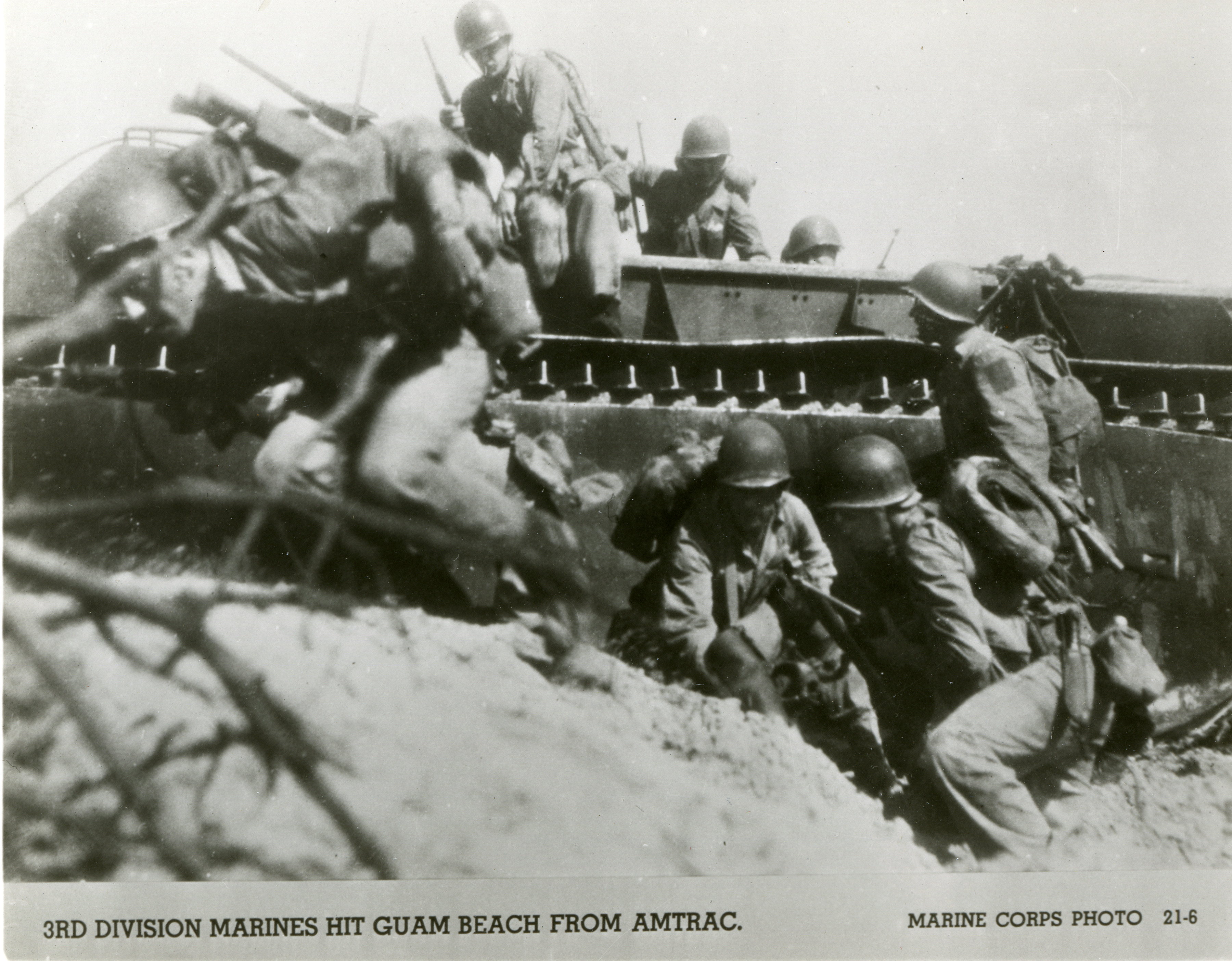 US Marines leaping from a LVT-1 onto a beach, Guam, 1944 | The Digital ...